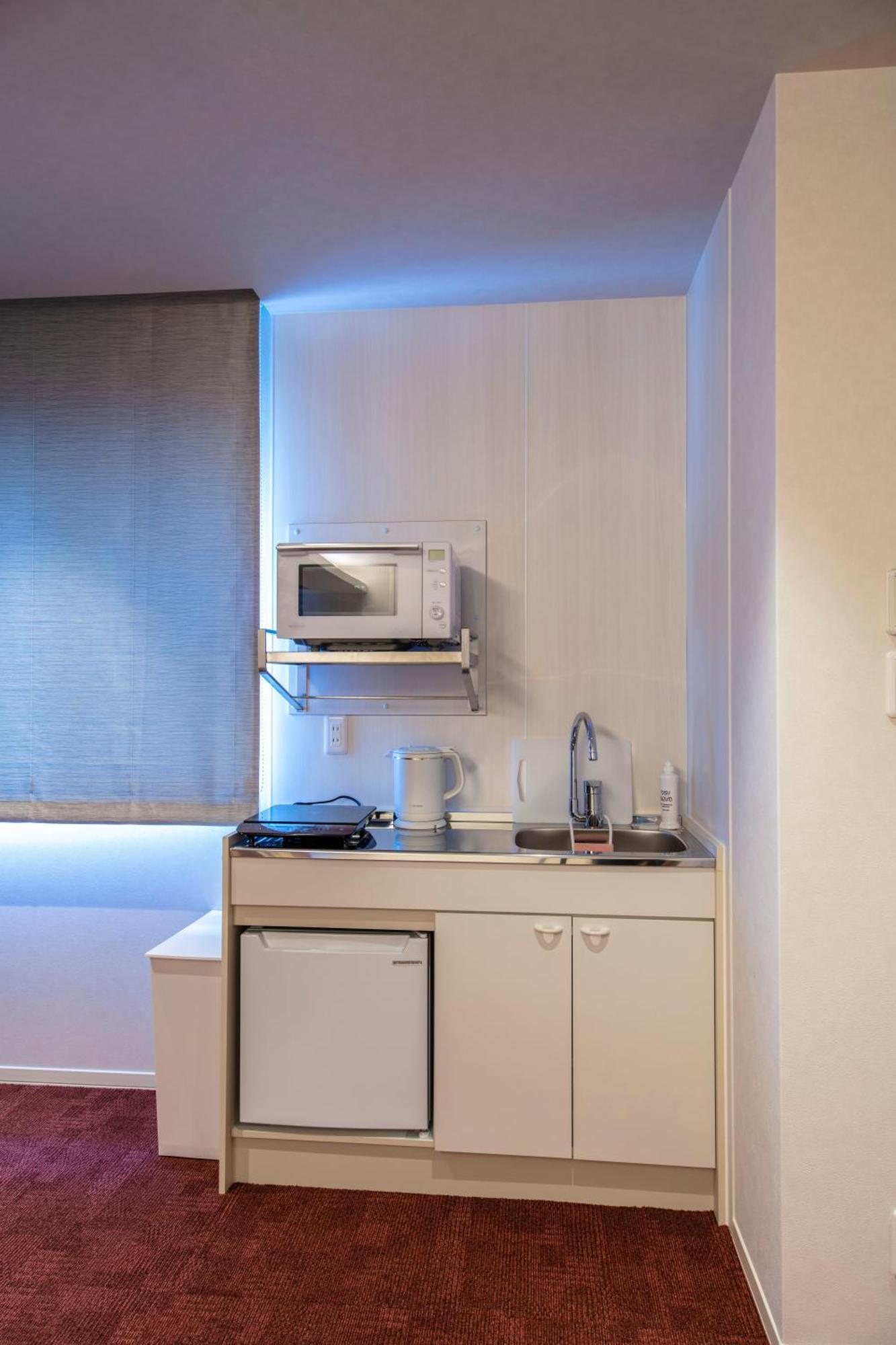 Grand Base Okayama Ekimae Aparthotel Exterior photo